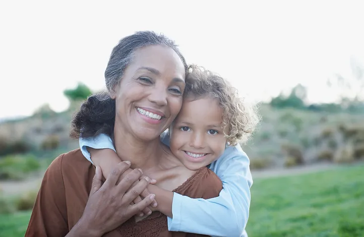 Grandma and Grandchild in Embrace Blue Stone Hills Dentistry